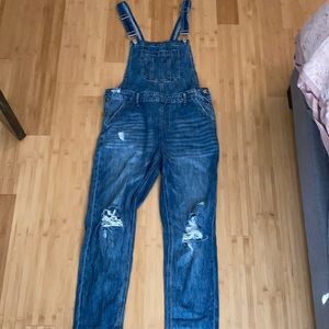 Distressed jean overalls
